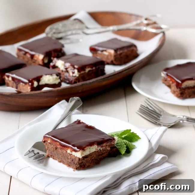 A slice of Chocolate Mint Cookie Bar, revealing its layers