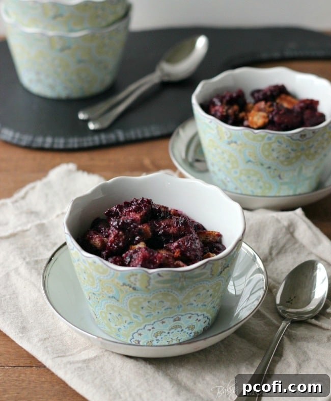 Cooked Blueberry Brown Betty served in a bowl, steam rising