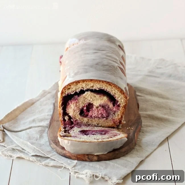 Delicious Whole Wheat Blackberry Cream Cheese Swirl Bread with Vanilla Bean Glaze