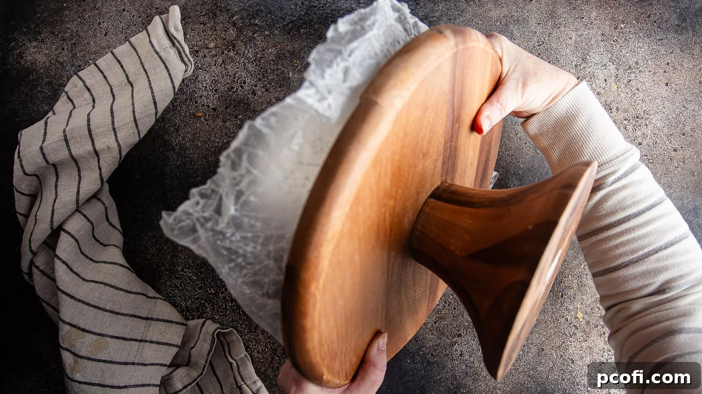 Flipping tiramisu cake onto the serving platter.