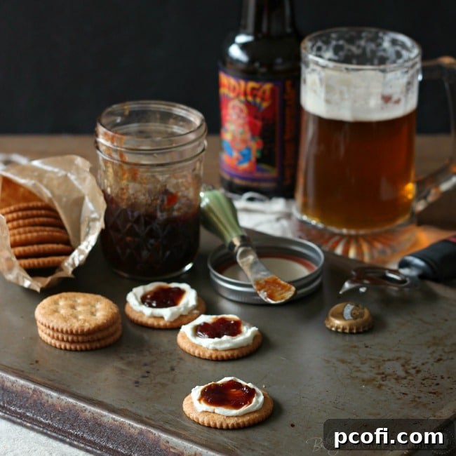 Finished jars of homemade tomato jam, artfully arranged on a rustic wooden surface