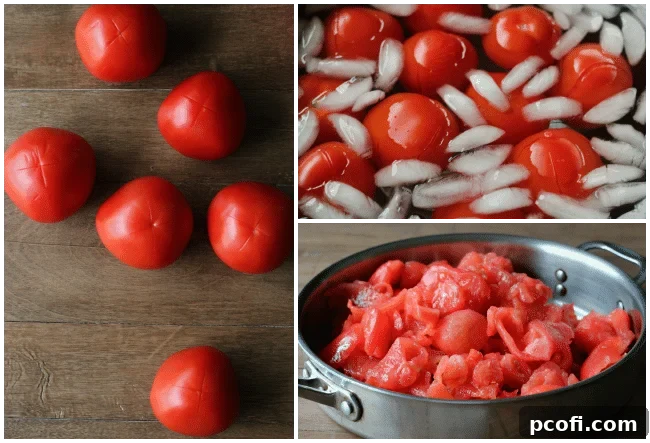Hands carefully peeling the skin off a blanched tomato over a kitchen sink