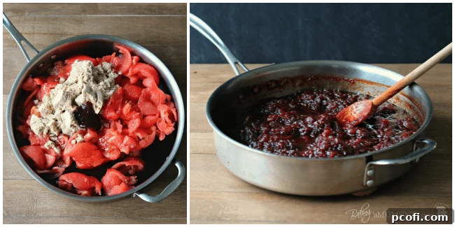 Halved tomatoes with seeds carefully removed, neatly arranged on a cutting board