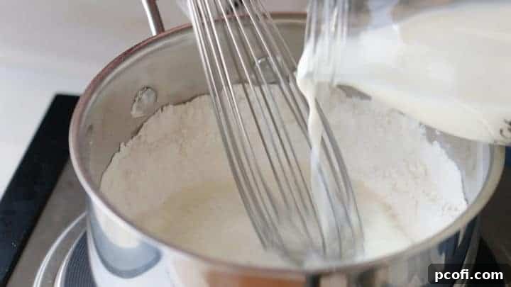Magical Cream Cheese Icing Whisking Milk