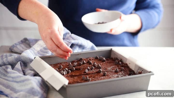 Baking brownies with chocolate chips on top.