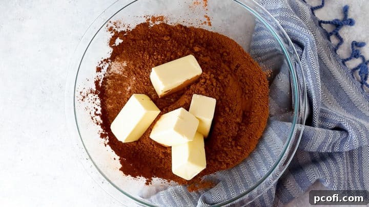 Sugar, cocoa powder, and butter in a large mixing bowl.