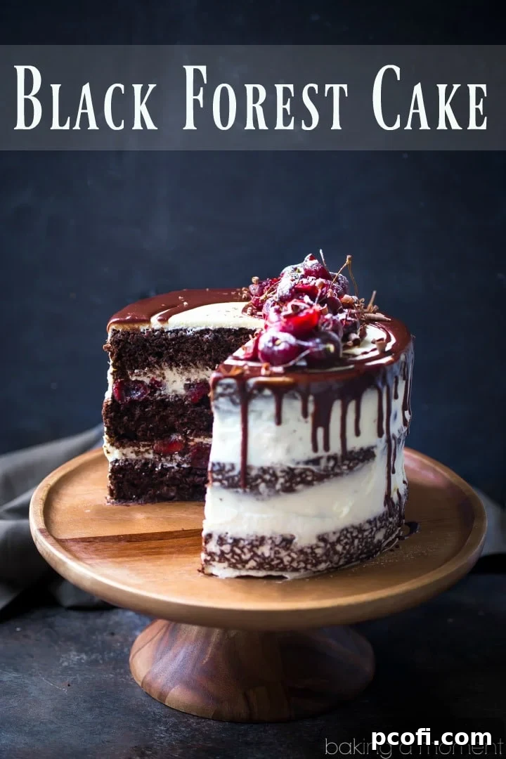 Close-up of a semi-naked Black Forest Cake, showing off the dark chocolate glaze dripping down its sides, adorned with fresh cherries and chocolate curls.