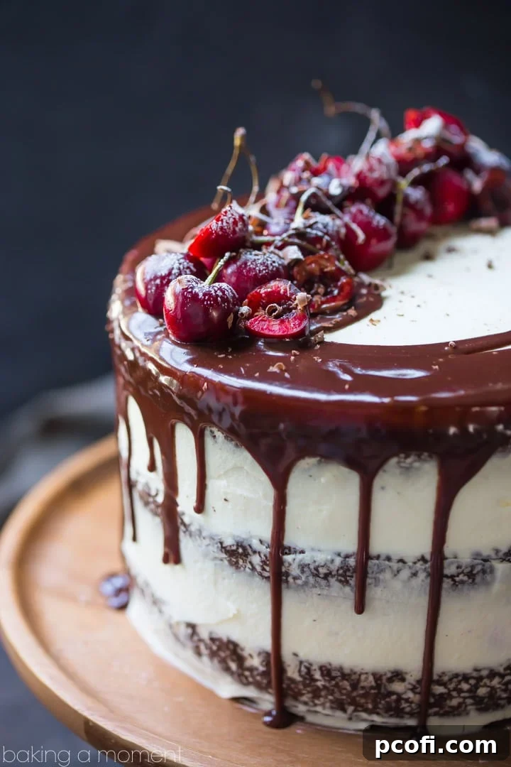 Inside view of Black Forest Cake layers, showcasing the moist chocolate cake, fresh cherry filling, and fluffy whipped cream.