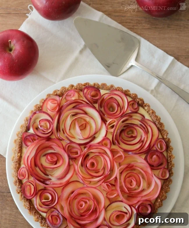 Close-up of a Slice of Apple Rose Tart with Maple Custard Filling and Walnut Crust