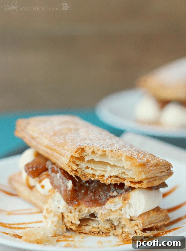 Top view of Caramelized Apple and Goat Cheese Mousse Mille Feuilles, garnished