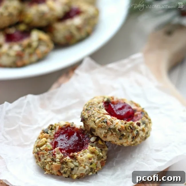 Cranberry Pistachio Cream Cheese Thumbprint Cookies | Baking a Moment