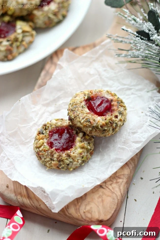 Cranberry Pistachio Cream Cheese Thumbprint Cookies | Baking a Moment