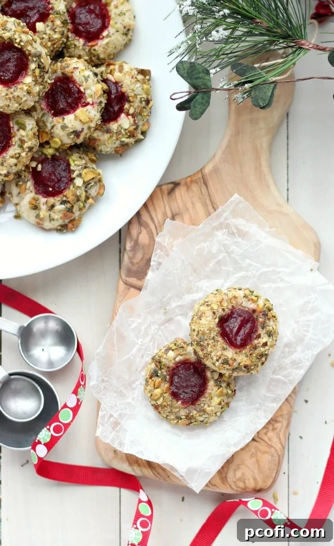 Cranberry Pistachio Cream Cheese Thumbprint Cookies | Baking a Moment