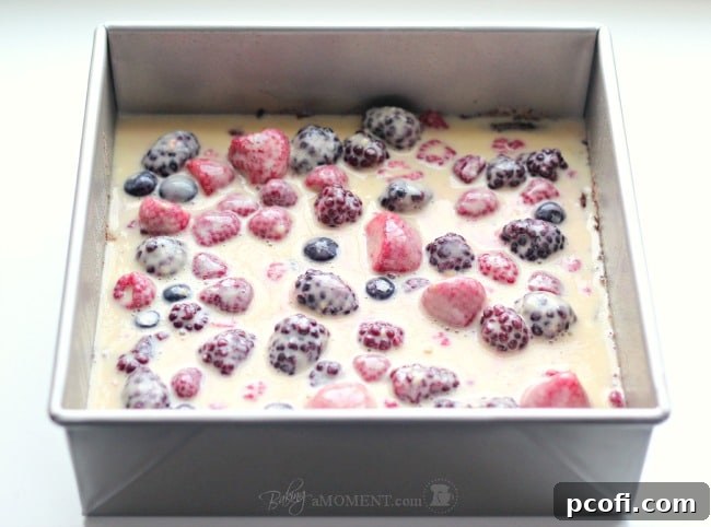 Cross-section of Berry Chocolate Streusel Bars, showing distinct layers of chocolate crust, berry custard, and streusel topping