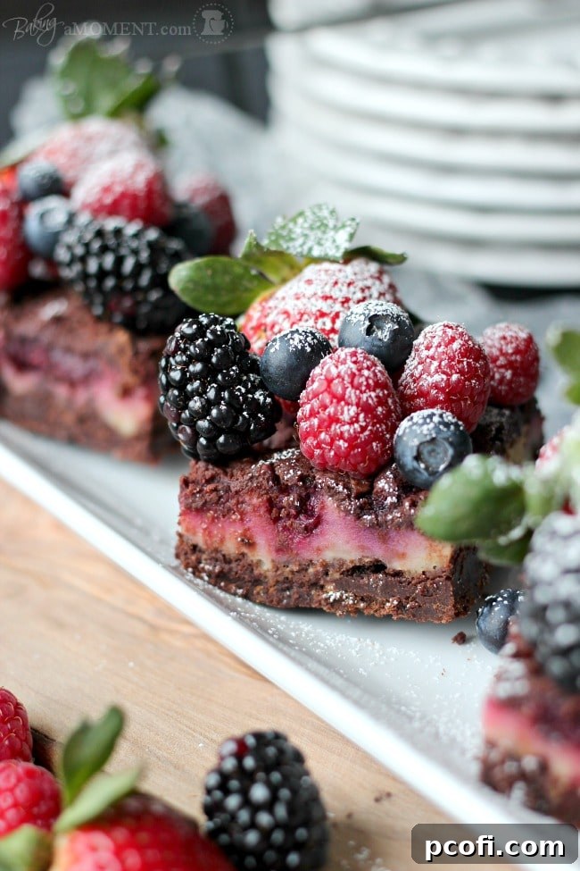 Overhead shot of Berry Chocolate Streusel Bars garnished with fresh berries and powdered sugar