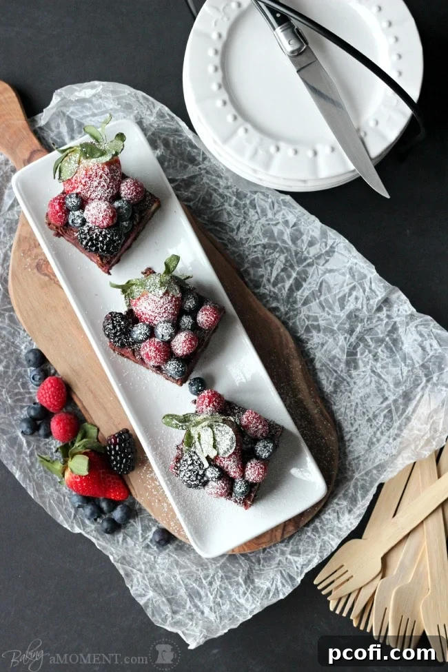 Artfully arranged Berry Chocolate Streusel Bars with berries, ready to serve