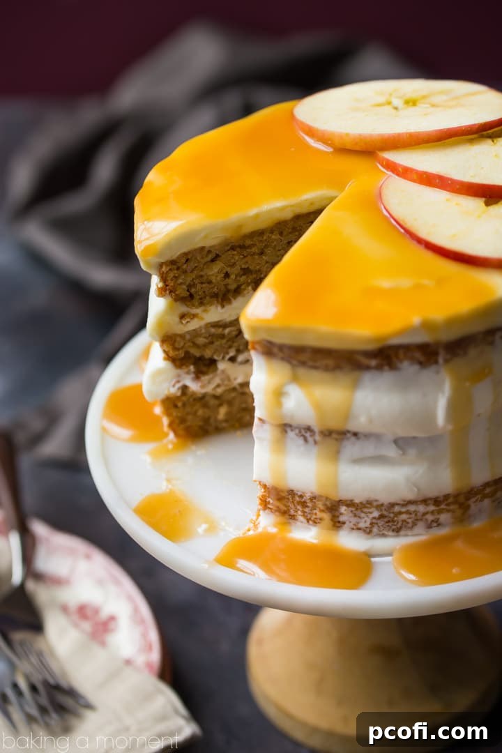 A close-up of the Apple Honey Cake, emphasizing the generous layers of frosting and the golden honey caramel, inviting a delicious bite.