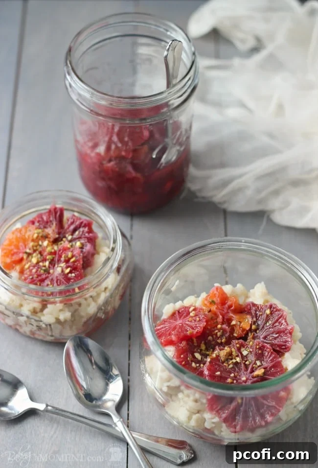 Beautifully plated rice pudding with blood oranges, vanilla cardamom syrup, and a sprinkle of pistachios, highlighting vibrant colors and inviting textures.