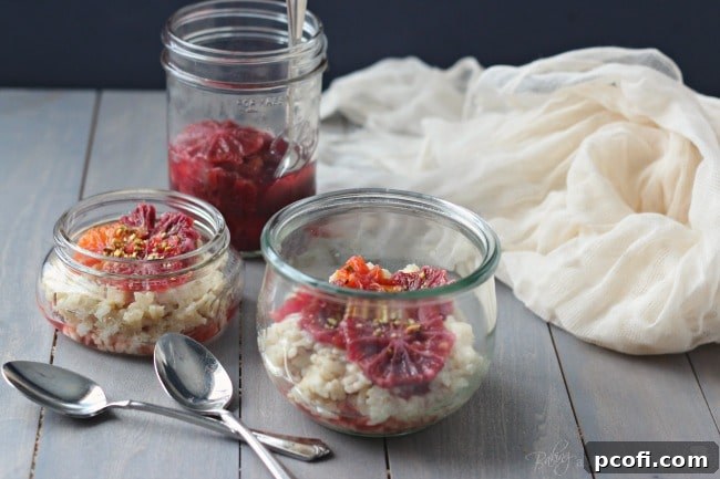 A close-up of a serving of rice pudding with blood oranges, vanilla cardamom syrup, and pistachios, showcasing its inviting texture and fresh ingredients.