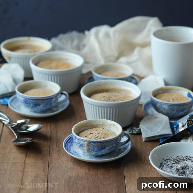 Fluffy English Teatime Pudding Cakes infused with Bigelow English Teatime flavor, served warm for a comforting treat.