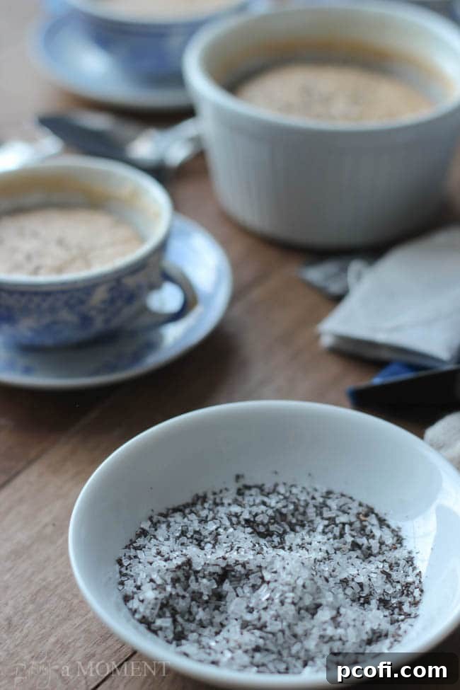 A close-up of the English Teatime Pudding Cake, highlighting its moist interior and delicate tea sugar topping.