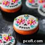 Day of the Dead Cupcakes with colorful fondant skull toppers
