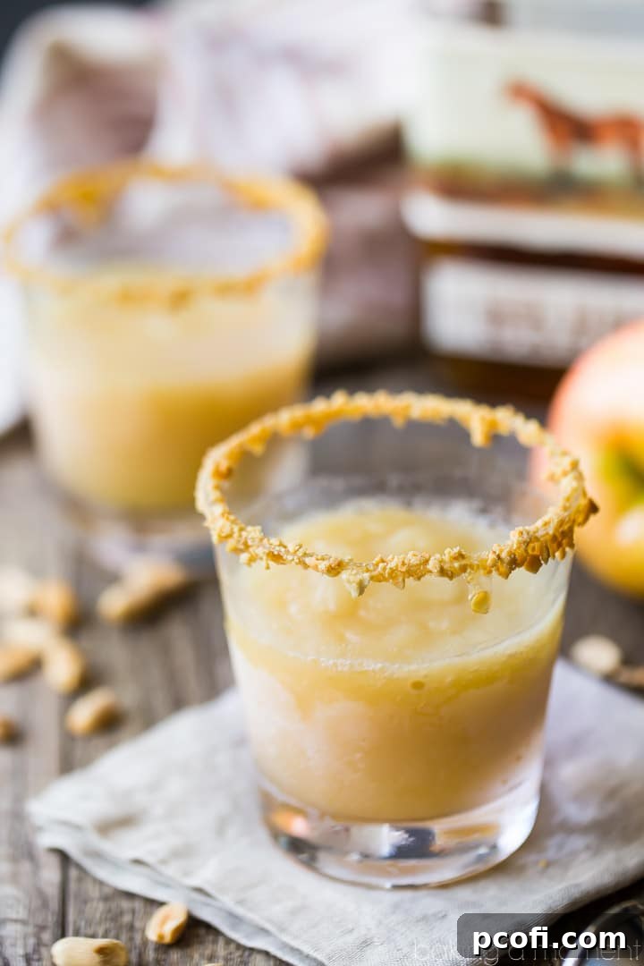 Caramel Apple Bourbon Slush: made with real apples and apple cider, buttery caramel, and toasty bourbon. A perfect fall sipper! #drinks #cocktails #fall
