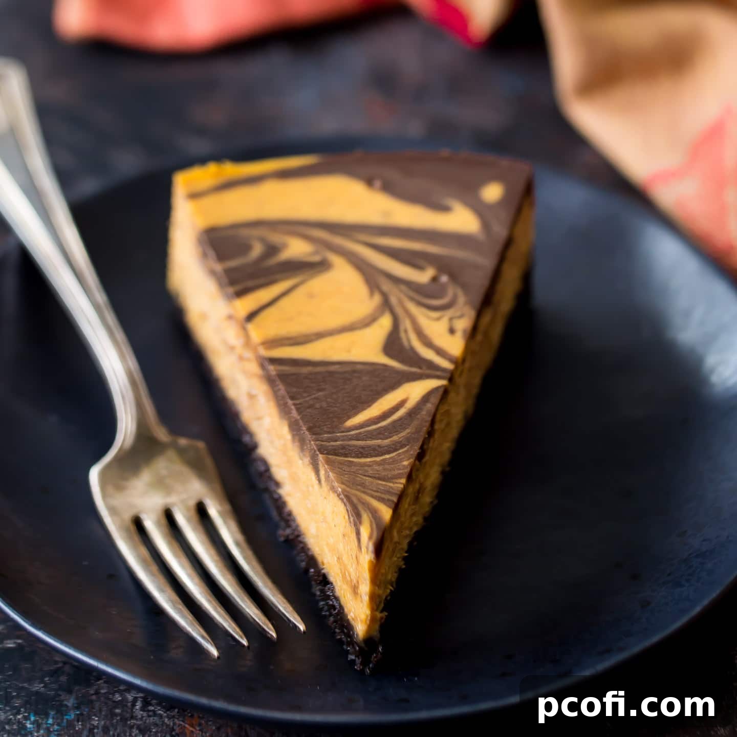 A stunning Pumpkin Chocolate Swirl Cheesecake, an irresistible blend of fall and chocolate.
