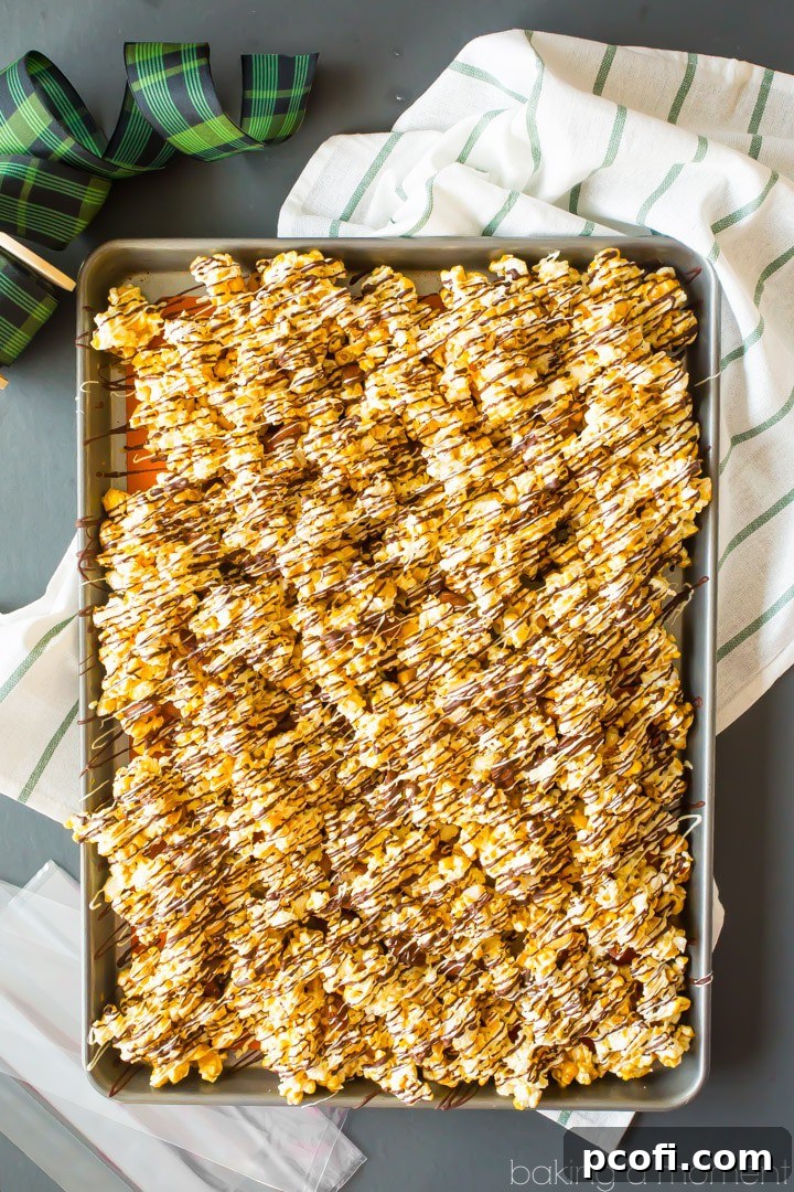 Homemade Moose Munch: Light, crisp butter toffee caramel popcorn with almonds and cashews, drizzled with white and dark chocolate. Makes a great holiday gift! #food #desserts #popcorn #caramel #homemade #holiday #gift #recipe