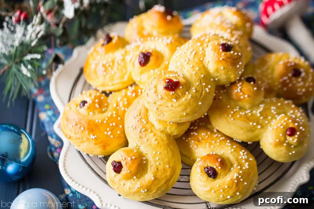 A stunning arrangement of saffron-scented Lucia Buns, delicately sprinkled with sugar and adorned with dried cranberries, positioned on a rustic wooden surface with festive holiday decor in the background. These soft, slightly sweet pastries represent a beloved centuries-old Scandinavian tradition, perfectly complementing a cup of coffee. Keywords: food, bread, desserts, baking, Swedish, luciabuns, stluciaday, holiday, saffron, Christmas baking.