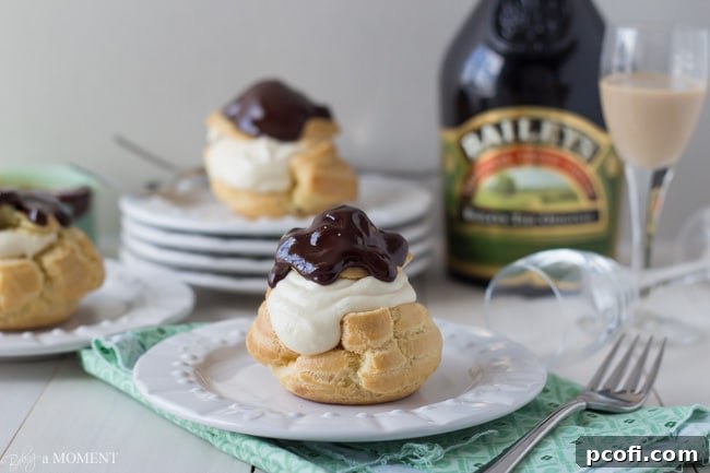A close-up shot of an Irish Cream Profiterole, highlighting the delicate pastry and creamy filling.