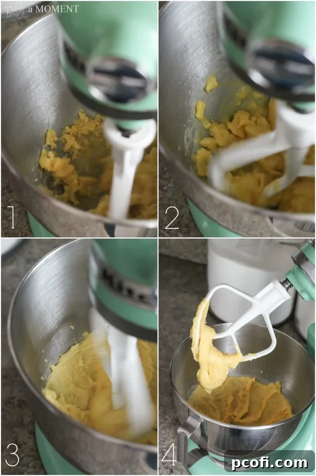 Adding eggs one by one to the choux pastry dough in a stand mixer