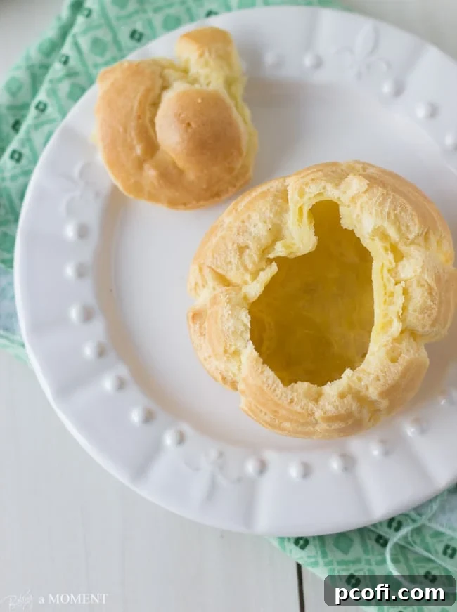 Freshly baked and puffed cream puff shells out of the oven