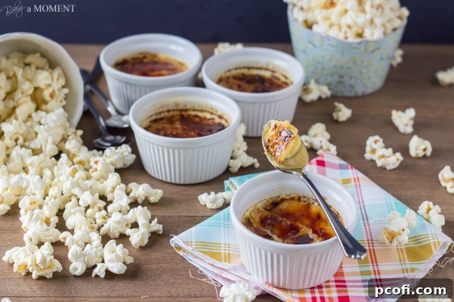 Two crème brûlée ramekins on a wooden surface.