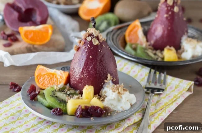 Overhead view of Sangria Poached Pears with crumble and mint garnish