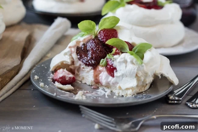 Assembled Pavlova with basil garnish