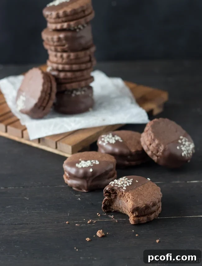 Stack of Chocolate Sesame Butter Sandwich Cookies, showcasing their appealing golden-brown edges.