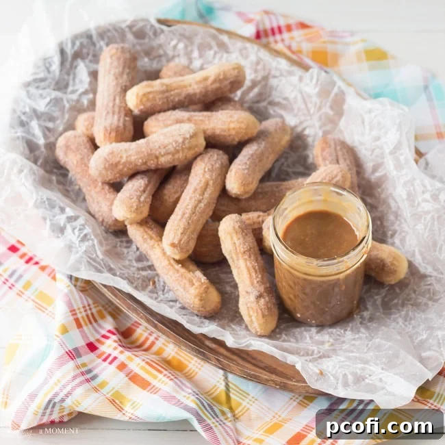 Homemade Cajeta and Baked Churros - Golden Mexican caramel sauce next to a pile of crispy baked churros dusted with cinnamon sugar.