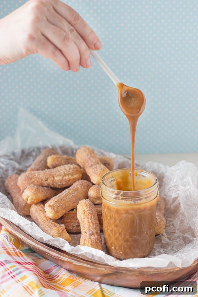 Close-up of Homemade Cajeta in a bowl, showcasing its thick, pourable consistency.