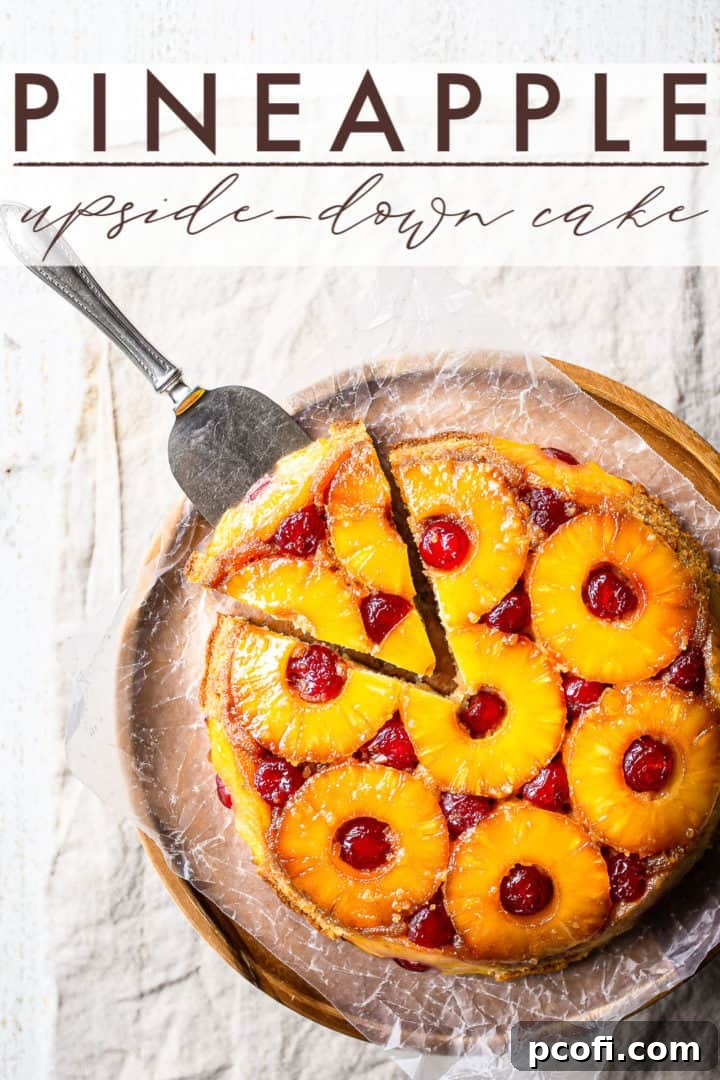 Baked pineapple upside-down cake in a round baking pan, ready to be inverted onto a serving pedestal.