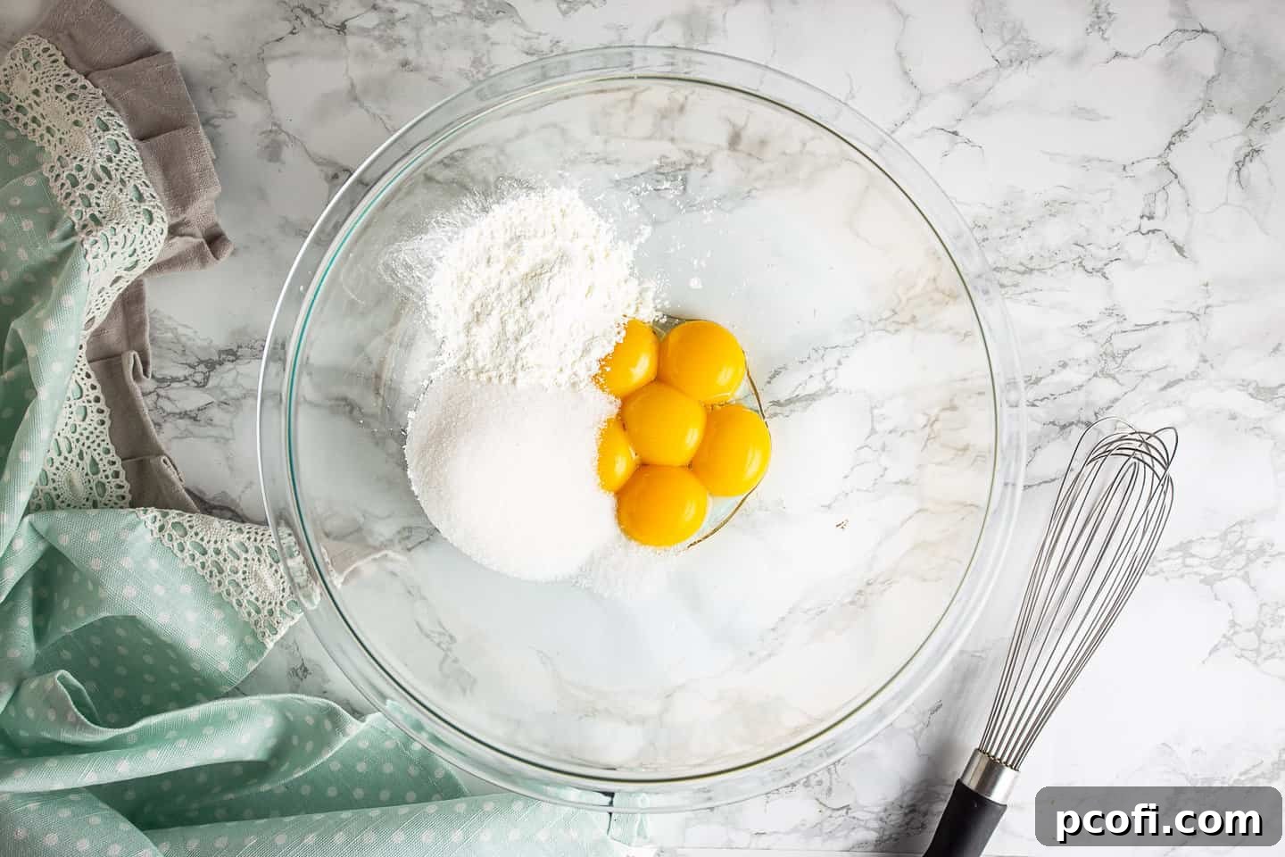 Egg yolks, sugar, cornstarch, and salt in a large glass mixing bowl.