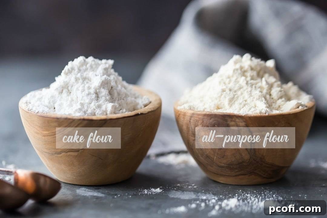 A visual comparison of cake flour and all-purpose flour, demonstrating the noticeable difference in color and texture, with cake flour appearing whiter and finer.