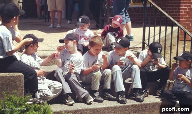 A candid moment at a little league game, a Norman Rockwell scene