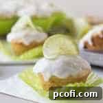 Coconut Lime Glazed Muffins with a slice of lime on top