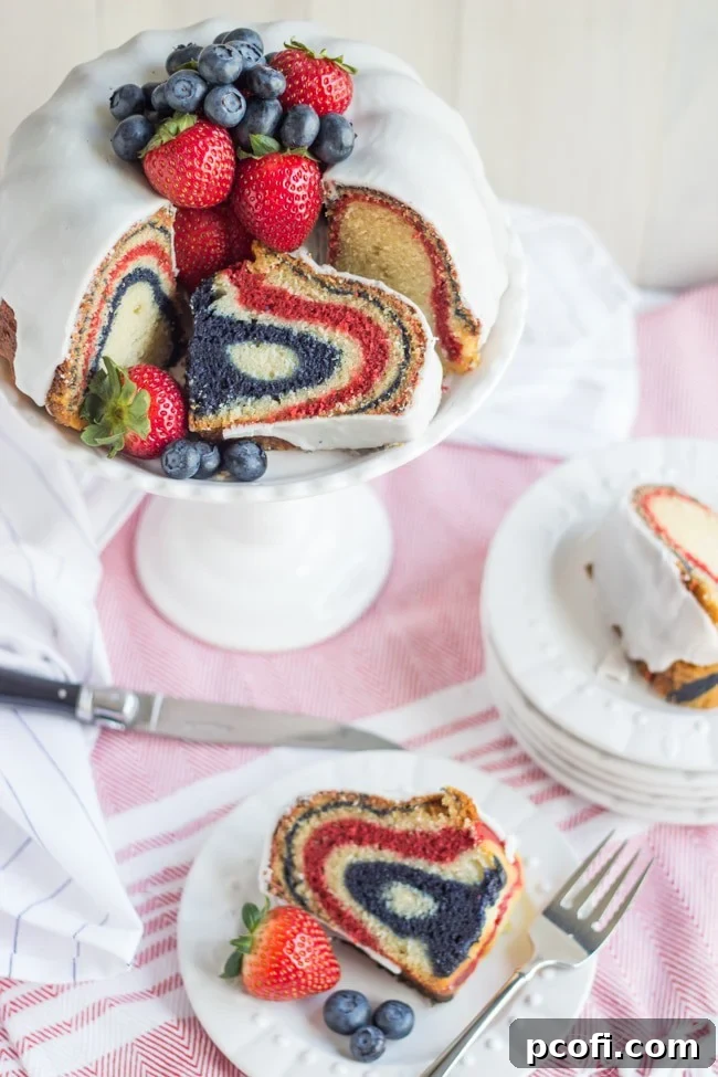 Red, White, & Blue Velvet Bundt Cake with Greek Yogurt Glaze and Berries | Baking a Moment