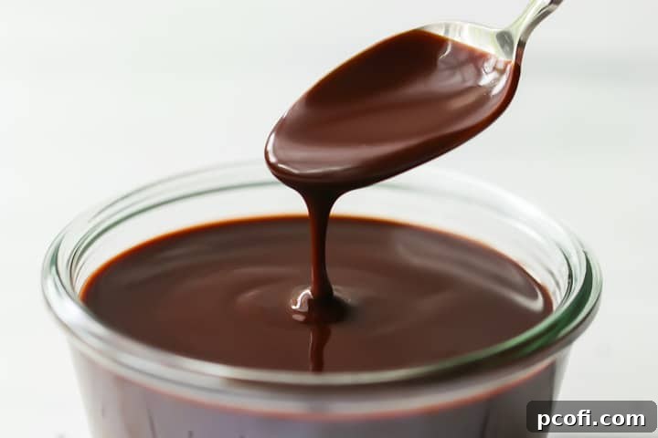 A bowl of easy, basic chocolate glaze, perfect for drizzling on a wide variety of desserts and treats.