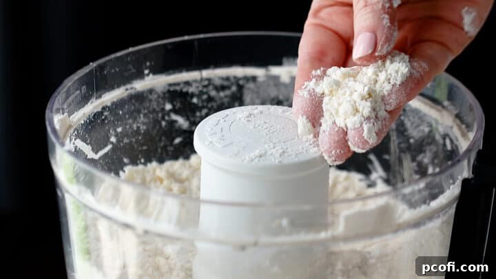 Butter worked into dry ingredients until the mixture resembles coarse meal.