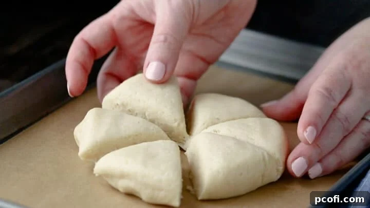 Pulling unbaked scones slightly apart.