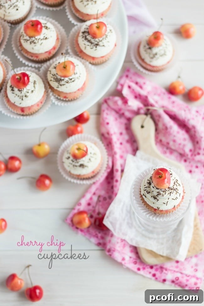 Close-up of Cherry Chip Cupakes with fluffy Bourbon Vanilla Frosting