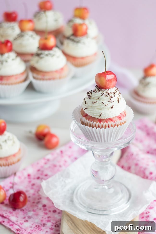 Close-up of Cherry Chip Cupcakes with Bourbon Vanilla Frosting, decorated for #CookfortheCure